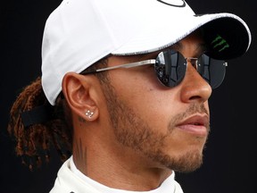 Mercedes' Lewis Hamilton poses for a drivers portrait.