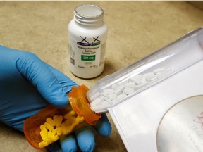 The drug hydroxychloroquine, pushed by U.S. President Donald Trump and others in recent months as a possible treatment to people infected with the coronavirus disease (COVID-19), is displayed by a pharmacist at the Rock Canyon Pharmacy in Provo, Utah, U.S., May 27, 2020.