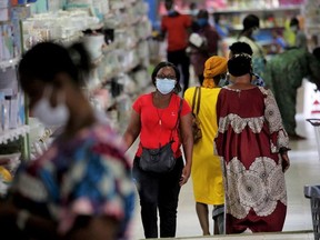 A woman wearing a protective face mask shops at Chic Shops supermarket, amid the coronavirus disease (COVID-19) outbreak at Adjame, a neighbourhood of Abidjan, Ivory Coast May 28, 2020.