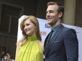 Actor James Van Der Beek (right) and his wife Kimberly arrive for the screening of Labor Day at the Ryerson Theatre during the Toronto International Film Festival, Sept. 7, 2013.