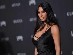 In this file photo taken on November 3, 2018 Kim Kardashian West arrives for the 2018 LACMA Art+Film Gala at the Los Angeles County Museum of Art in Los Angeles.