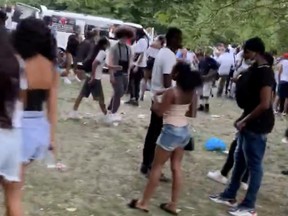 Peple gather at an illegal rave in London, England, Thursday, June 25, 2020, in this still image taken from a video obtained on social media.