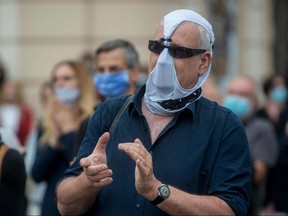 A man wearing a homemade face mask takes part in a protest on June 9, 2020 at the Old Town Square in Prague.
