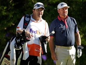 Graeme McDowell talks to his caddie, Ken Comboy, as he prepares to tee off during the FedEx St. Jude Classic at TPC Southwind on June 9, 2017 in Memphis.