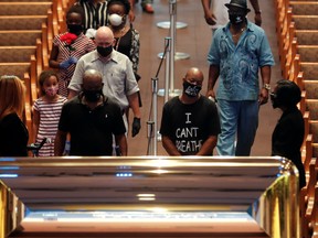 People pay their respects during the public viewing for George Floyd, whose death in Minneapolis police custody has sparked nationwide protests against racial inequality, at The Fountain of Praise church in Houston, Texas, U.S., June 8, 2020.