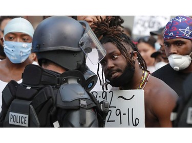 CP-Web.  Demonstrators face off with police in riot gear in downtown Raleigh, N.C., Saturday, May 30, 2020 during a protest over the death of George Floyd, who died in police custody on Memorial Day in Minneapolis. (Ethan Hyman/The News & Observer via AP) ORG XMIT: NCRAL705