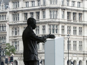 The Nelson Mandela statue is seen in front of boarding surrounding The statue of Winston Churchill in Parliament Square, following protests against the death of George Floyd who died in police custody in Minneapolis, London, Britain, June 12, 2020.