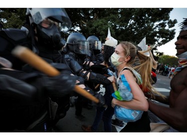 Police in riot gear force protesters back during nationwide unrest following the death in Minneapolis police custody of George Floyd, in Raleigh, North Carolina, U.S. May 31, 2020. Picture taken May 31, 2020. REUTERS/Jonathan Drake ORG XMIT: JAD100