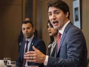 Prime Minister Justin Trudeau, alongside Liberal MPs (from left) Marwan Tabbara and Bardish Chagger meet with Region of Waterloo mayors and delivers brief opening remarks in Kitchener, Ont., on Wednesday, April 17, 2019.