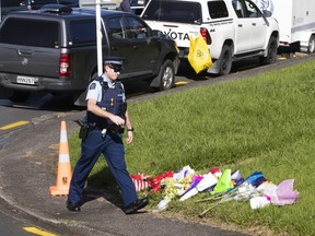 Fellow officers and members of the local community placed flowers near the scene on Reynella Drive where Constable Matthew Hunt was killed June 20, 2020 in Auckland, New Zealand.