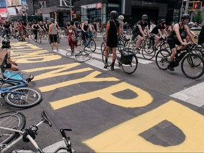 Cyclists gather in Times Square, protesting systemic racism in law enforcement and the police killing of unarmed black Americans on June 20, 2020 in New York.