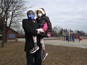 Obi Ifedi and his daughter Zoe pose for a photo at Michelle Park in Ottawa Wednesday.