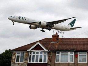 A Pakistan International Airlines Boeing 777 lands at Heathrow airport in London on June 8, 2020.