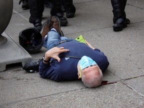 Martin Gugino, a 75-year-old protester, lays on the ground after he was shoved by two Buffalo, New York, police officers during a protest against the death in Minneapolis police custody of George Floyd in Niagara Square in Buffalo, New York, U.S., June 4, 2020.