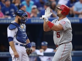 Albert Pujols of the Los Angeles Angels celebrates after hitting a home run against the Toronto Blue Jays on August 24, 2016 at Rogers Centre in Toronto.