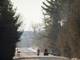 A family of four from Pakistan walk down Roxham Road in Champlain, N.Y. towards the U.S.-Canada border on Feb. 28, 2017.