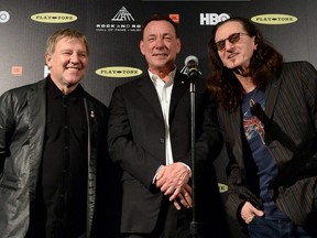 Alex Lifeson, Neil Peart, and Geddy Lee pose in the press room at the 28th Annual Rock and Roll Hall of Fame Induction Ceremony at Nokia Theatre L.A. Live on April 18, 2013 in Los Angeles.