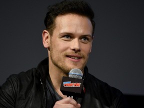 Sam Heughan speaks onstage during the Outlander panel during New York Comic Con at Jacob Javits Center on October 6, 2018 in New York City.