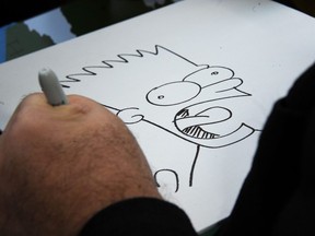Cartoonist Matt Groening, creator of "The Simpsons," draws Bart Simpson for fans as he is honored with a star on the Hollywood Walk of Fame in in Hollywood.