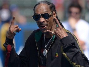 Snoop Dogg gestures before a game between the Houston Texans and Los Angeles Chargers at Dignity Health Sports Park.