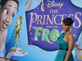 In this file photo actress Anika Noni Rose, the voice of Princess Tiana (at left on the poster), poses as she arrives for the world premiere screening of Disney's "The Princess and The Frog," at Walt Disney Studios in Burbank, Calif., Nov. 15, 2009.