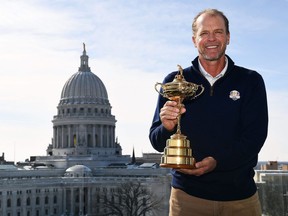 Steve Stricker poses with the Ryder Cup trophy as he is announced as the United States Ryder Cup Captain on Feb. 19, 2019 in Madison, Wisc.
