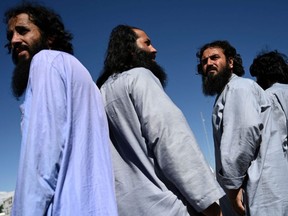 Taliban prisoners wait to be released from the Bagram prison, next to the U.S. military base in Bagram, Afghanistan, May 26, 2020.