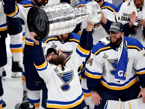 St. Louis Blues winger Chris Thorburn holds the Stanley Cup after the Blues defeated the Boston Bruins in the Stanley Cup Final at TD Garden.