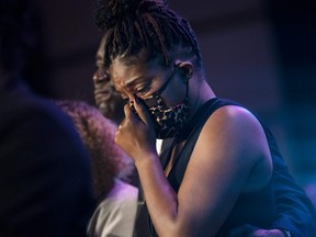 Actress Tiffany Haddish cries as those gathered at a memorial service at North Central University pause silently for eight minutes and 46 seconds in Minneapolis, June 4, 2020.