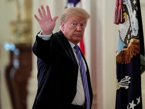 U.S. President Donald Trump waves as he departs following a meeting of the American Workforce Policy Advisory Board in the East Room at the White House in Washington June 26, 2020.