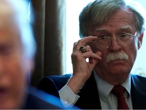 National Security Adviser John Bolton listens as U.S. President Donald Trump holds a Cabinet meeting at the White House in Washington, U.S., April 9, 2018.