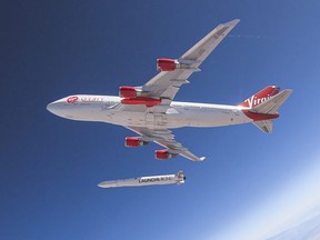 This handout photo obtained May 25, 2020 courtesy of Virgin Orbit shows Cosmic Girl as it releases LauncherOne mid-air for the first time during a July 2019 drop test.