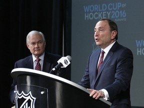 FILE - In this file photo from Jan. 24, 2015, NHL commissioner Gary Bettman, right, and NHL Players Association executive director Donald Fehr announce the return of the World Cup of Hockey in 2016 in Toronto.