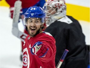 Phillip Danault points to teammate Brendan Gallagher after scoring a goal during Montreal Canadiens training camp practice at the Bell Sports Complex in Brossard on July 15, 2020.