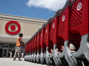 A Target store employee collects shopping carts to bring back into the store on August 21, 2019 in Pembroke Pines, Florida.