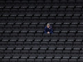 Edmonton Oilers head coach Dave Tippett watches a scrimmage from the empty stands of Rogers Place on July 13, 2020.