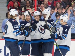 The Winnipeg Jets celebrate a goal scored by center Mark Scheifele (55) in the first period against the Ottawa Senators at the Canadian Tire Centre. Marc DesRosiers-USA TODAY Sports ORG