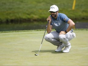 Canadian Adam Hadwin eyes his putt on the ninth hole during the first round of the Workday Charity Open golf tournament at Muirfield Village Golf Club.