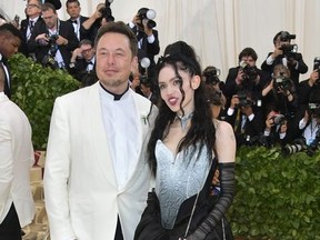 Elon Musk and Grimes attend the Heavenly Bodies: Fashion & The Catholic Imagination Costume Institute Gala at The Metropolitan Museum of Art on May 7, 2018 in New York City.