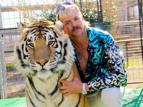 This undated file photo courtesy of Netflix shows Joseph "Joe Exotic" Maldonado-Passage with one of his tigers.