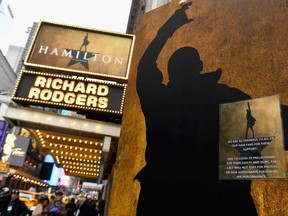 In this file photo a sign for at Hamilton, an American musical on Broadway is viewed on March 12, 2020 in New York City.