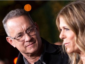 In this file photo taken on Nov. 7, 2018 actors Tom Hanks (L) and his wife actress/singer Rita Wilson attend "JONI 75: A Birthday Celebration" Live at the Dorothy Chandler Pavilion in Los Angeles.