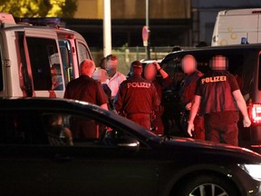 Police detain a man after a raid in Linz on July 4, 2020, in which they arrested a suspect in the killing of a Russian asylum seaker who was shot dead earlier in the evening in Gerasdorf, near Vienna. (Photo by MATTHIAS LAUBER / APA / AFP) / Austria OUT (Photo by MATTHIAS LAUBER/APA/AFP via Getty Images)