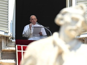 Pope Francis delivers his Sunday Angelus prayer to pilgrims gathered in St. Peter's square at the Vatican on July 12, 2020. -