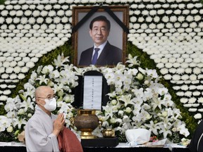 A Buddhist monk pays his respects at a public memorial for late Seoul mayor Park Won-soon at Seoul City Hall in Seoul on July 13, 2020.