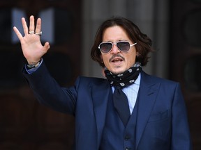 Johnny Depp arrives to attend the sixth day of his libel trial against News Group Newspapers (NGN), at the High Court in London, on July 14, 2020.