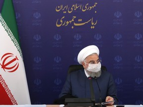 A handout picture provided by the Iranian Presidency on July 18, 2020, shows President Hassan Rouhani listening during a meeting of the national taskforce to combat the COVID-19 pandemic, in the capital Tehran.