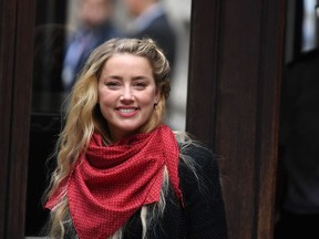 US actress Amber Heard arrives on day thirteen of the libel trial by her former husband US actor Johnny Depp against News Group Newspapers (NGN), at the High Court in London, on July 23, 2020.