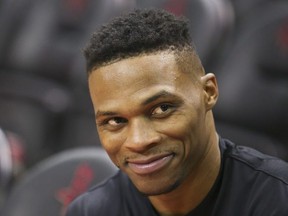Houston Rockets guard Russell Westbrook (0) smiles during warmups before playing against the Phoenix Suns at Toyota Center.