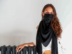 A model poses as she wears a "scarfmask" by The Wolf Belgium and created by Belgian stylist Aude De Wolf, in a store amid the coronavirus disease (COVID-19) outbreak in Brussels, Belgium July 19, 2020.